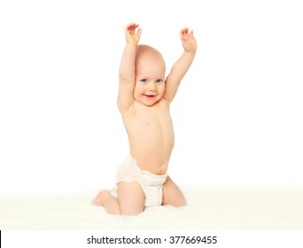 Happy smiling little baby playing on the bed 