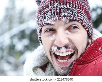 Happy Smiling Man With Snow In His Face In Winter