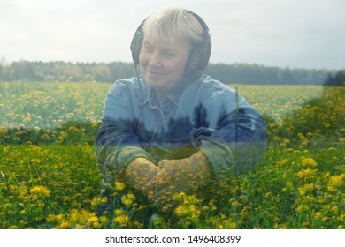 Happy smiling mature woman sitting wearing headphones and listen to relaxation music on field with alot of yellow flowers. Double exposure. Sonic Therapy. Sensivity to nature.  - Powered by Shutterstock