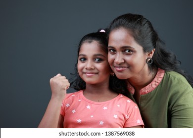 Happy smiling mother and daughter of Indian origin
