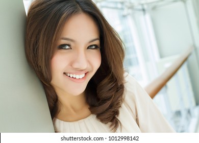 happy smiling positive asian caucasian business woman portrait