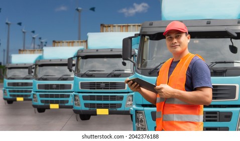 Happy Smiling Proud Confident Asian Young Man Beard Professional Truck Driver In Business Long Transport. Male Owner Small Business Transportation Trucking Driving And Delivering Goods To Warehouse.