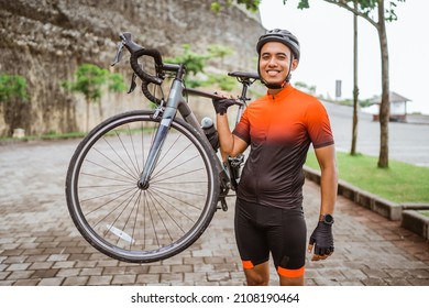 happy smiling road bike cyclist while riding his bike outdoor