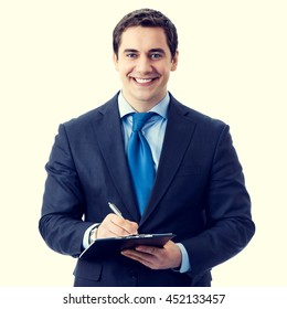 Happy smiling senior businessman with clipboard writing - Shutterstock ID 452133457