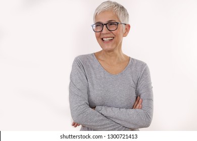 Happy Smiling Senior Woman Wering Glasses On White Background.