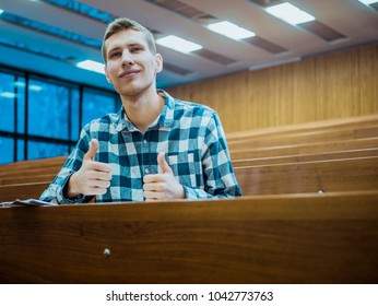 Happy Smiling Student Big Finger In The Empty Big Lecture Hall