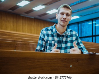 Happy Smiling Student Big Finger In The Empty Big Lecture Hall