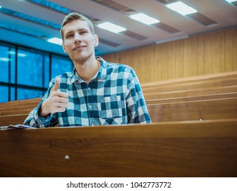 Happy Smiling Student Big Finger In The Empty Big Lecture Hall