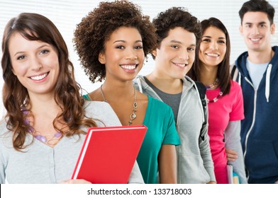 Happy Smiling Students Standing In Row