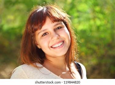 Happy Smiling Teen Girl Outdoors