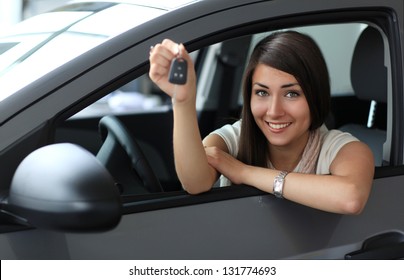 Happy Smiling Woman With Car Key. Driving