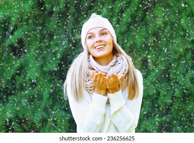 Happy Smiling Woman Having Fun Outdoors And Enjoys The Snow