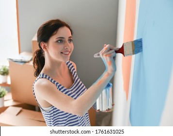 9,524 Woman painting wall blue Images, Stock Photos & Vectors ...