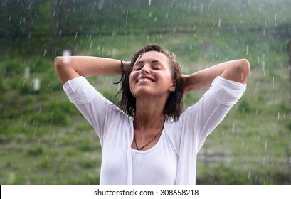 Happy Smiling Woman Is Under The Rain