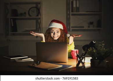 Happy Smiling Woman Using Laptop At Home On New Year's Eve, Working Until Late Evening Or Choosing Presents Online, Copy Space