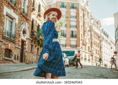 Happy, Smiling Woman Wearing Stylish Autumn Blue Checkered Dress, Orange Hat, Wide White Belt, Walking In Street Of Paris. Copy, Empty Space For Text