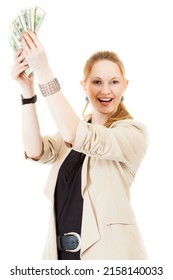 happy smiling young blond long-haired bookkeeper wearing black one-piecer and jacket is standing with wad of notes (100 dollars) in her hands, isolated on white background
