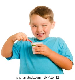 Happy Smiling Young Child Eating Yogurt Isolated On White