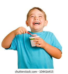 Happy Smiling Young Child Eating Yogurt Isolated On White