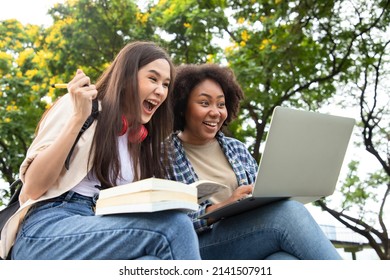 Happy Smiling Young Diversity Woman With Happy College Friends In Background At The Summer Park. Multiethnic And Diversity Student Doing Homework And Submit Assignments To Teachers. Education Concept.