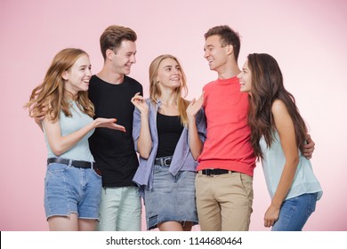 Happy smiling young group of friends standing together talking and laughing. Best friends - Shutterstock ID 1144680464