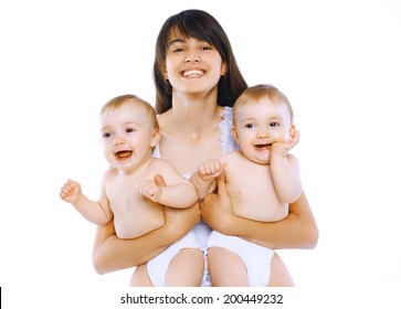 Happy Smiling Young Mother Holding Two Twin Babies On White Background