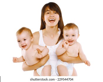 Happy Smiling Young Mother Holding Two Twin Babies On White Background