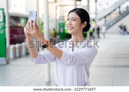 Similar – Image, Stock Photo Young woman vlogging outdoors with a mobile gimbal