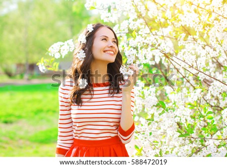 Similar – Image, Stock Photo Young woman enjoying cherry blossoms in springtime