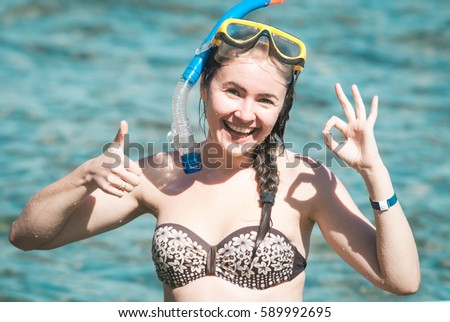 happy smiling young woman wearing mask for diving at the Red Sea