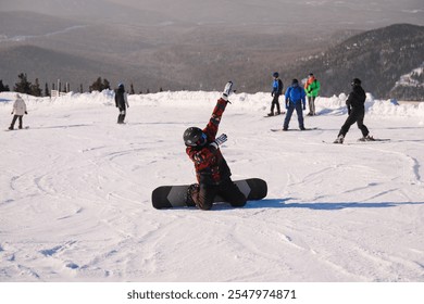 happy snowboarder, happy with vacation, snowboarder in the middle of snowy slope sitting on his knees - Powered by Shutterstock