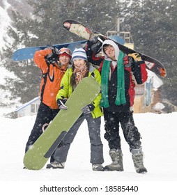 Happy Snowboarding Team In Winter Mountains, Health Lifestyle (series Sport, Extreme, Mountains, Horses And Teenagers)