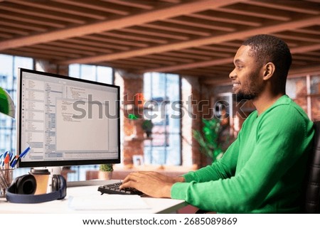 Happy software developer at PC coding, creating software, implementing algorithms. Cheerful IT expert in home office working with code editor, building applications, optimizing performance