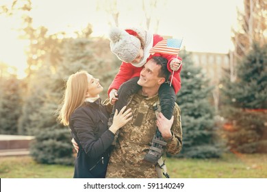 Happy Soldier With Family In Park