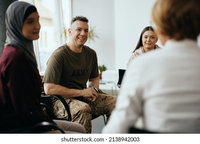 Happy Soldier And Group Of People Having Group Therapy At Mental Healthcare Center.