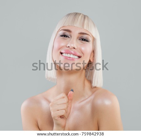 Happy Spa Woman Having Fun. Smiling Model with Blonde Hair 