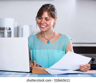 Happy Spanish Adult Girl Applying For Bank Loan At Home