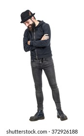 Happy Spontaneous Laughing Hipster With Fedora Hat Looking Down. Full Body Length Portrait Isolated Over White Studio Background.