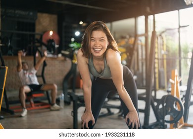 happy sport women exercise workout smile training at the gym. athlete girl training strong and good health and strength