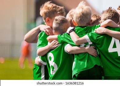 Happy Sports Boys in a School Team. Kids Huddling in a Team on Tournament Competition Before the Final Match. Players Gathering Together in a Circle to Strategize and Motivate  - Powered by Shutterstock