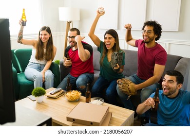 Happy Sports Fans Cheering The Baseball Championship While Watching The Game On Tv