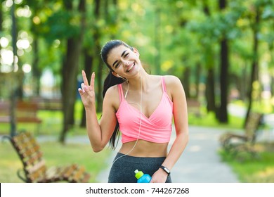 The happy sportswoman gesture outdoor