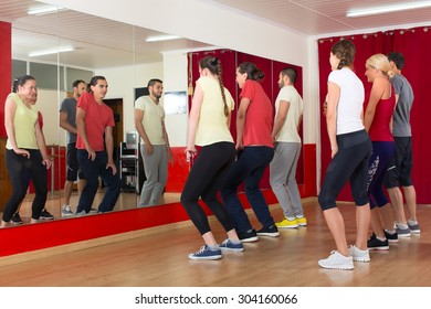 Happy Sporty Adults Dancing At Dance Class 