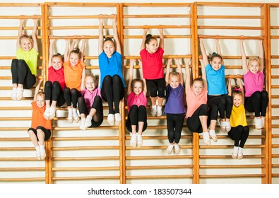 Happy sporty children in gym