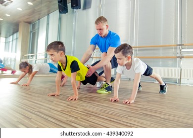 Happy sporty children in gym.
