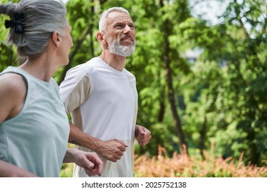 Happy Spouses Running With Each Other At The Morning And Feeling Great And Satisfied