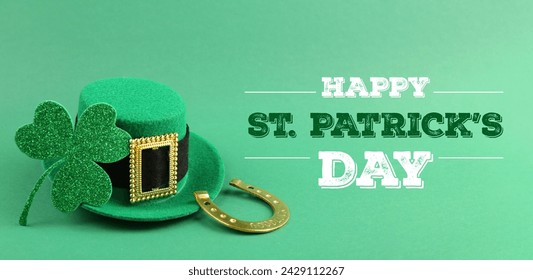 Happy St. Patrick's day card. Leprechaun hat, golden horseshoe, text and clover leaf on green background. Banner design - Powered by Shutterstock