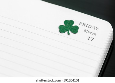 Happy St. Patrick's day date 17 march 2017 friday in diary with handmade paper shamrock - Powered by Shutterstock