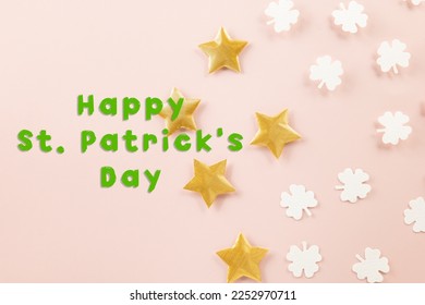 Happy St Patricks Day decoration background. above top view of paper clover leaves festive decor, shamrocks leaves holiday symbol with copy space on colour background, Banner greeting card concept - Powered by Shutterstock