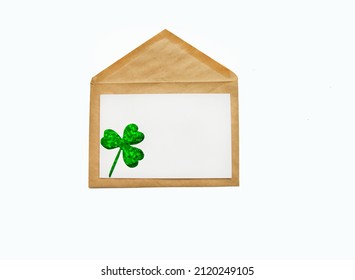 Happy St. Patrick's Day . Green Shamrock Clover Leaves On Craft Envelope.